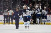 Winnipeg Jets center Vladislav Namestnikov (7) leaves the game with a team member after sustaining an injury during the third period of an NHL hockey preseason game against Minnesota Wild, Tuesday, Sept. 30, 2025, in St. Paul, Minn. (AP Photo/Abbie Parr)