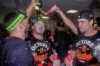 Detroit Tigers bullpen catcher Chris Chinea, left, catcher Jake Rogers, center, and catcher Dillon Dingler, right, celebrate in the locker room after defeating the Cleveland Guardians in Game 3 of an American League wild card baseball game in Cleveland, Thursday, Oct. 2, 2025. (AP Photo/Sue Ogrocki)
