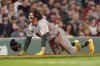 Athletics Jacob Wilson gets up diving safely into home on an RBI double by Tyler Soderstrom in the sixth inning against the Boston Red Sox in a baseball game, Tuesday, Sept. 16, 2025, in Boston. (AP Photo/Robert F. Bukaty)