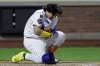 New York Mets' Francisco Alvarez reacts after being hit by a pitch during the eighth inning of a baseball game against the San Diego Padres, Tuesday, Sept. 16, 2025, in New York. (AP Photo/Adam Hunger)