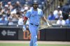 Toronto Blue Jays slugger Anthony Santander walks back to the dugout after striking out during the first inning of a baseball game against the Tampa Bay Rays on May 25, 2025, in Tampa, Fla. (AP Photo/Phelan M. Ebenhack)