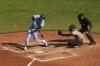 Toronto Blue Jays outfielder Joey Loperfido (10) hits a RBI double in front of Baltimore Orioles catcher Alex Jackson (70) during sixth inning MLB baseball action in Toronto on Sunday September 14, 2025. THE CANADIAN PRESS/Chris Young