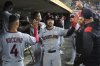 Cleveland Guardians' Steven Kwan celebrates scoring against the Detroit Tigersduring the10th inning of a baseball game Tuesday, Sept. 16, 2025, in Detroit. (AP Photo/Paul Sancya)