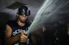 Toronto Blue Jays pitcher Kevin Gausman celebrates with teammates in the clubhouse after their baseball game against the Kansas City Royals on Sept. 21, 2025, in Kansas City, Mo. (AP Photo/Charlie Riedel)