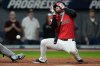 Cleveland Guardians' David Fry falls back after being hit in the face with his own bunt in the sixth inning of a baseball game against the Detroit Tigers in Cleveland, Tuesday, Sept. 23, 2025. (AP Photo/Sue Ogrocki)