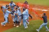 Toronto Blue Jays' Alejandro Kirk (fourth left) is congratulated by teammates after hitting an RBI sacrifice fly to defeat the Baltimore Orioles during ninth inning MLB baseball action, in Toronto on Saturday, September 13, 2025. THE CANADIAN PRESS/Chris Young
