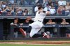 New York Yankees' Aaron Judge slides into home plate to score on a single hit by Giancarlo Stanton during the fourth inning of a baseball game against the Baltimore Orioles, Sunday, Sept. 28, 2025, in New York. (AP Photo/Pamela Smith)