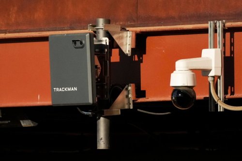 FILE - A Trackman device used for the Automated Ball-Strike System is posted on the balcony behind home plate before a spring training baseball game between the Kansas City Royals and the Los Angeles Dodgers, Saturday, Feb. 22, 2025, in Phoenix. (AP Photo/Ashley Landis, file)
