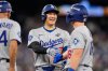 Los Angeles Dodgers' Shohei Ohtani and Will Smith talk during the eighth inning in Game 6 of baseball's World Series against the Toronto Blue Jays, Friday, Oct. 31, 2025, in Toronto. (AP Photo/Brynn Anderson)