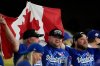 Toronto Blue Jays fans celebrate after Game 5 of baseball's World Series against the Los Angeles Dodgers, Wednesday, Oct. 29, 2025, in Los Angeles. (AP Photo/Ashley Landis)