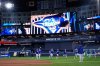 Members of the Los Angeles Dodgers warm up during a team workout on Oct. 23, 2025, in Toronto. The Blue Jays were scheduled to meet the Dodgers in Game 1 of the World Series on Friday. (AP Photo/Brynn Anderson)