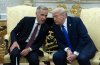 Prime Minister Mark Carney speaks with United States President Donald Trump as they take questions from the media at the start of a meeting in the Oval Office in the White House, in Washington, D.C.  Tuesday, Oct 7, 2025 in Washington.  THE CANADIAN PRESS/Adrian Wyld