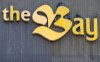 Pigeons roost on a Hudson's Bay department store sign in downtown Montreal on Monday, March 17, 2025. THE CANADIAN PRESS/Christinne Muschi