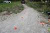 SUPPLIED
                                A photo in the IIU report shows evidence markers on the gravel road.