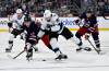 Winnipeg Jets&rsquo; Jonathan Toews (19) and Utah Mammoth Kevin Stenlund (82) battle for the puck during the second period of their NHL hockey game in Winnipeg, Sunday, Oct. 26, 2025. THE CANADIAN PRESS/Fred Greenslade