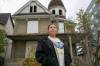 BROOK JONES/FREE PRESS
                                Danielle Pahpasay says it&rsquo;s only a matter of time before the vacant house at 539 William Ave. (pictured) that she lives next to, goes up in flames and takes her home with it.