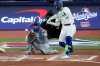 Toronto Blue Jays' Bo Bichette swings for a three run home run off Los Angeles Dodgers' Shohei Ohtani during the third inning in Game 7 of baseball's World Series, Saturday, Nov. 1, 2025, in Toronto. (AP Photo/Ashley Landis)