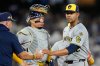 Milwaukee Brewers pitcher Jose Quintana leaves the game against the Los Angeles Dodgers during the third inning in Game 4 of baseball's National League Championship Series, Friday, Oct. 17, 2025, in Los Angeles. (AP Photo/Brynn Anderson)