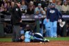 Toronto Blue Jays' George Springer falls after being hit by a pitch against the Seattle Mariners during the seventh inning in Game 5 of baseball's American League Championship Series, Friday, Oct. 17, 2025, in Seattle. (AP Photo/Lindsey Wasson)
