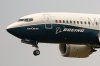 FILE - A Boeing 737 Max jet prepares to land at Boeing Field following a test flight in Seattle, Sept. 30, 2020. (AP Photo/Elaine Thompson, File)