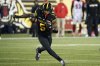 Hamilton Tiger-Cats running back Greg Bell (5) carries the ball during second half CFL football game action against the Ottawa Redblacks in Hamilton, Ont. on Friday, October 24, 2025. THE CANADIAN PRESS/Peter Power