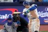 Toronto Blue Jays' George Springer strikes out during the eighth inning in Game 2 of baseball's World Series against the Los Angeles Dodgers, Saturday, Oct. 25, 2025, in Toronto. (AP Photo/David J. Phillip)
