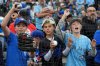 Toronto Blue Jays fans with balls and markers hope to get an autograph before first inning MLB American League Championship Series Game 4 baseball action between the Seattle Mariners and the Toronto Blue Jays, in Seattle, Thursday, Oct. 16, 2025. THE CANADIAN PRESS/Frank Gunn