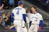 Toronto Blue Jays' Ernie Clement celebrates with George Springer after scoring on a double by Andrés Giménez during the sixth inning in Game 7 of baseball's World Series against the Los Angeles Dodgers, Saturday, Nov. 1, 2025, in Toronto. ASSOCIATED PRESS/Brynn Anderson
