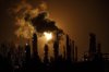 A flare stack lights the sky from the Imperial Oil refinery in Edmonton Alta, on Friday Dec. 28, 2018. Alberta's oilsands are at the centre of a closely watched court battle in New York today. The state's attorney general is accusing Exxon, which has extensive oilsands interests through its subsidiary Imperial Oil, of deliberately misrepresenting the risks those operations face as governments move to fight climate change. THE CANADIAN PRESS/Jason Franson