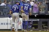 Blue Jays shortstop Bo Bichette (11) is helped off the field by Isiah Kiner-Falefa (7) after hurting his knee during the sixth inning of a Major League Baseball game against the Yankees on Sept. 6, 2025, in New York. (AP Photo/Adam Hunger)
