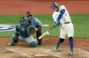 Toronto Blue Jays outfielder George Springer (4) hits a 3 run home run during seventh inning MLB American League Championship Series game 7 baseball action against the Seattle Mariners, in Toronto, Monday, Oct. 20, 2025. THE CANADIAN PRESS/Chris Young