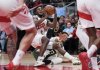 Toronto Raptors' Immanuel Quickley (5) battles for the ball against Milwaukee Bucks' Ryan Rollins (13) during first half NBA action in Toronto on Tuesday, November 4, 2025. THE CANADIAN PRESS/Nathan Denette