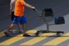 A shopper pushes a shopping carts as they leave a Real Canadian Superstore in Ottawa on Tuesday, June 25, 2024. THE CANADIAN PRESS/Sean Kilpatrick