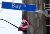 The Bay Street Financial District is shown with the Canadian flag in Toronto on Friday, Aug. 5, 2022. THE CANADIAN PRESS/Nathan Denette