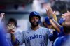 FILE - Kansas City Royals' Maikel Garcia (11) high-fives teammates after scoring a run during the first inning of a baseball game against the Los Angeles Angels Tuesday, Sept. 23, 2025, in Anaheim, Calif. (AP Photo/Eric Thayer, File)