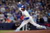 Toronto Blue Jays pitcher Kevin Gausman throws against the Los Angeles Dodgers during the first inning in Game 2 of baseball's World Series, Saturday, Oct. 25, 2025, in Toronto. (AP Photo/Brynn Anderson)