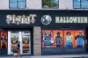 A person walks their dog past the storefront of a Spirit Halloween on Avenue Road, in Toronto, Wednesday, Sept. 21, 2022. THE CANADIAN PRESS/Alex Lupul