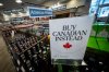 A sign is placed in front of the American whiskey section at a B.C. liquor store after top-selling American products were being removed from shelves in Vancouver, B.C., on Sunday, Feb. 2, 2025. THE CANADIAN PRESS/Ethan Cairns