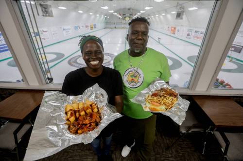 photos by JOHN WOODS / FREE PRESS
                                Donna Taylor, social marketing manager, and Vincent Dennis, owner of Tropical Thunder located at 431 Grassmere Rd.