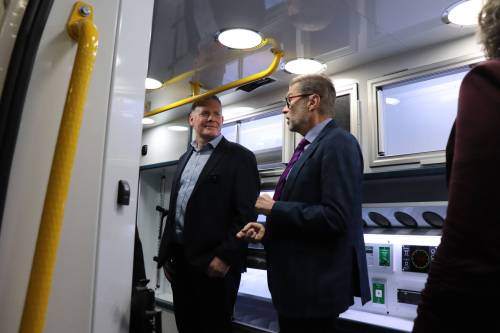 MoveMobility founder Richard Jones (left) chats with Winnipeg West MP Dr. Doug Eyolfson inside one of the company&rsquo;s custom ambulance vans on Friday following a $1.1 million federal investment. (Tyler Searle / Free Press)