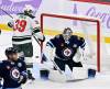 FRED GREENSLADE / THE CANADIAN PRESS
                                Winnipeg Jets&rsquo; goaltender Eric Comrie (1) makes a save on a Minnesota Wild shot as Ben Jones (39) looks for the rebound during the third period of Sunday&rsquo;s game.