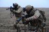In this photo taken on Sunday, Nov. 9, 2025 and provided by Ukraine's 127th Separate Brigade of the Territorial Defence press service, soldiers practice military skills on a training ground near Kupiansk in Kharkiv region, Ukraine. (Anatolii Lysianskyi/Ukraine's 127th Separate Brigade via AP)