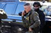 U.S. Border Patrol Commander at large Gregory Bovino takes a phone call, Monday, Nov. 17, 2025, in Charlotte, N.C. (AP Photo/Matt Kelley)
