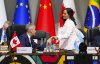 Prime Minister Mark Carney gives Minister of Foreign Affairs Anita Anand a fist-bump as she arrives to take part in a working session at the G20 Summit in Johannesburg, South Africa, on Sunday, Nov. 23, 2025. THE CANADIAN PRESS/Sean Kilpatrick