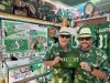 Lance Hackewich, left, a Roughriders superfan, poses for a photo in Regina with his son Nelson in a Tuesday, Nov. 11, 2025, handout photo.  THE CANADIAN PRESS/Handout - Lance Hackewich (Mandatory Credit)