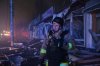 A rescuer works at a market destroyed by a Russian airstrike on Zaporizhzhia, Ukraine, Friday, Nov. 21, 2025. (AP Photo/Kateryna Klochko)
