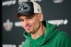 Saskatchewan Roughriders quarterback Trevor Harris speaks to the media as he arrives in Winnipeg, Monday, Nov. 10, 2025, as preparations begin for the 112th CFL Grey Cup. THE CANADIAN PRESS/David Lipnowski