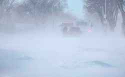 Strong winds kicked up falling snow, making visibility conditions near zero.  (Ruth Bonneville / Free Press)