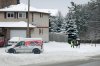 A Canada Post worker delivers mail in Barrie, Ont., after a large snowstorm blanketed the region one day before Christmas, Tuesday, Dec. 24, 2024. THE CANADIAN PRESS/Christopher Drost