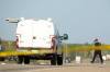 TIM SMITH / BRANDON SUN FILES
                                Investigators at the scene of a police shooting on the Trans-Canada Highway west of Carberry in May. A woman was found not criminally responsible in the incident. The officer had already been cleared in the shooting.